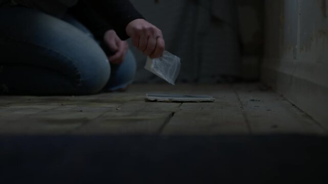 Addict cutting Illegal drugs in abandoned house