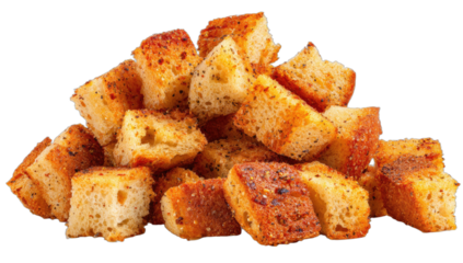 A pile of golden-brown, seasoned, oven-baked bread cubes, crunchy and delicious