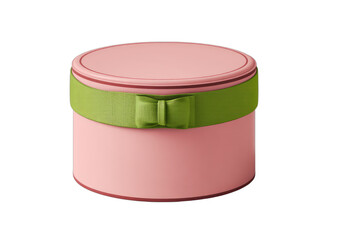 A pink cylindrical gift box with a green ribbon and bow on a black background