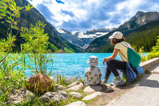 Mother and child admiring lake louise in banff national park