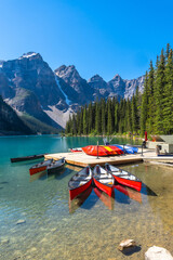 Fototapeta premium Canoes docked at moraine lake in banff national park, canadian rockies
