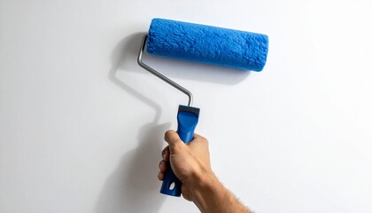 Paint Roller in Hand &ndash; Blue Foam Cover Applying Paint on White Wall