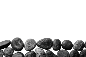Smooth, dark, rounded stones arranged in a textured wall against a black background