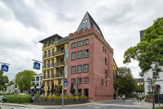 Koblenz, Germany - 16 September 2025: View of the Deutsches Eck area showcasing buildings with distinct architectural styles under a cloudy sky, contrasting textures of brick and modern facades.