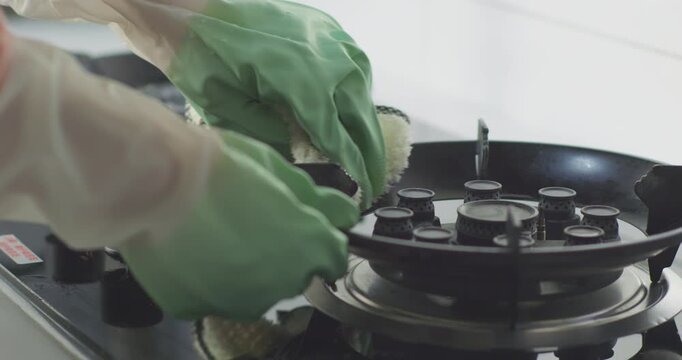Clean your range hood, wipe the stove, and wash the dishcloth.