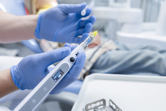 Endodontic device with file for root canal treatment in modern dental clinic