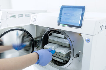 Autoclave sterilization of sealed dental instrument packs in clean modern clinic