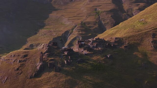 Aerial view of the ancient stone village of Kvavlo nestled in the rugged, sun-kissed slopes of the Caucasus mountains, Georgia, Dartlo, Tusheti, Georgia.