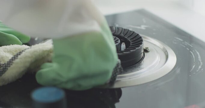 Clean your range hood, wipe the stove, and wash the dishcloth.