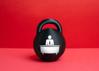A weight with an image of a bureaucrat. A concept of the burden of bureaucracy and an overly bloated administrative staff. Excessive regulation, institutional pressure, inefficient governance.