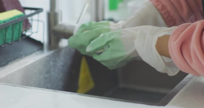 Clean your range hood, wipe the stove, and wash the dishcloth.