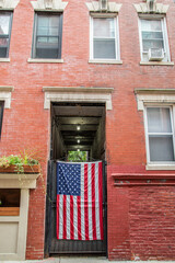 american flag in front of house