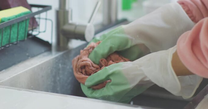 Clean your range hood, wipe the stove, and wash the dishcloth.