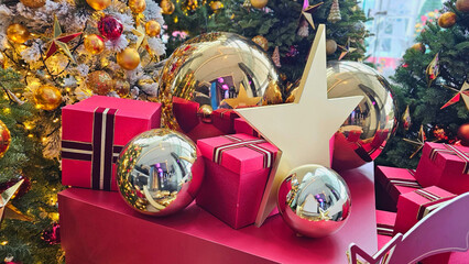 Warm and joyful Christmas holiday decoration featuring beautifully adorned Christmas trees with...