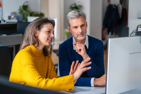 Businesswoman sharing ideas at office
