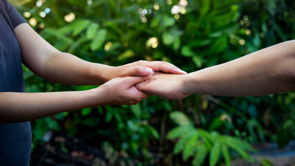 Woman hand as lending a helping hand as trust together Comfort with compassion concept