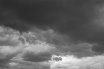 Obraz premium Black and white dramatic cloudy sky background. Weather conditions on an autumn day