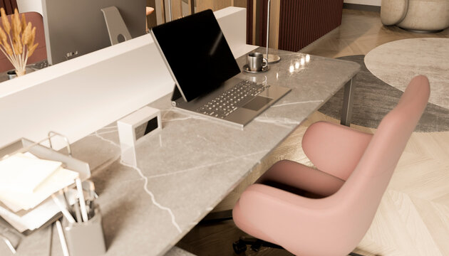 Modern marble desk setup with laptop and office accessories in workspace