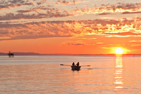 Rowboat on Lake Constance at sunset near Langenargen Germany