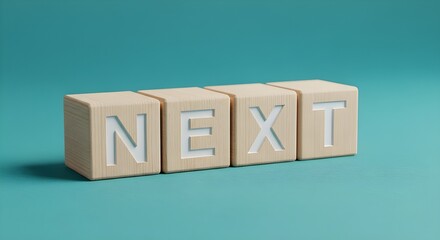 Wooden blocks spelling "NEXT" on teal background  