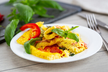 Fried omelette with vegetables and herbs