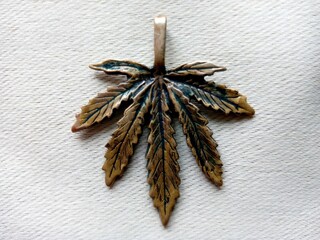 Hemp pendant on white jeans background