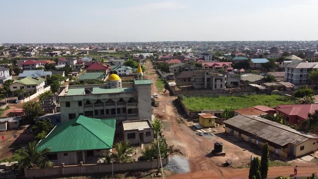 Drone aerial view, Accra Ghana skyline, African cityscape, urban landscape, modern buildings, city traffic, travel destination, Africa, cinematic aerial footage.