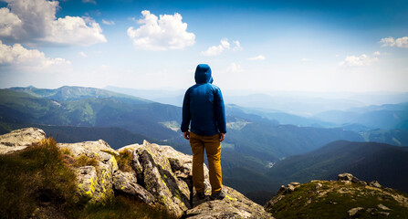 Man is hiking, travelling and climbing in the mountains.