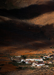 Top view through the clouds on Fuerteventura islands landscapes.