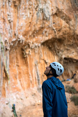 A man is hiking, climbing in the rocky mountains.