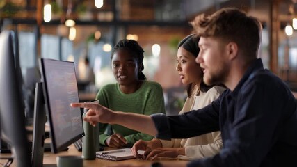 Team collaboration in an office setting to solve coding challenges during daylight hours - Powered by Adobe