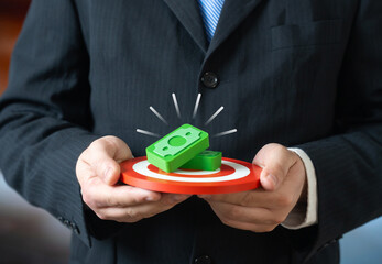 The manager puts a large bonus on the line to achieve the goal. Performance incentives, motivation leverage, reward based management. Accountability culture and results orientation.