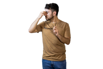 Young man suffering from strong headache or eye strain on white background. PNG