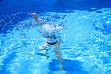 Drowning man reaches for help. Drowning man's hand sticks out of water. Risk, danger to life on water.