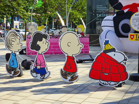 Taipei, Taiwan, Xinyi District, December 15, 2025 &ndash; Snoopy Family Cartoon Character Standees at Christmas with Taipei City Landmarks