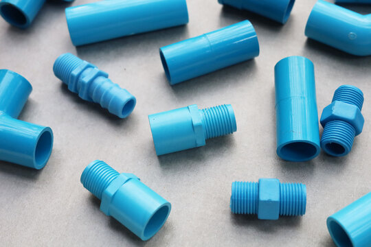 Assorted blue PVC connectors prepared for plumbing and piping work.