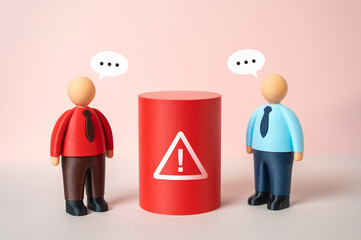 Two office workers discuss a problem and search for a solution. Teamwork in action, collaborative thinking. Workplace communication, conflict resolution and shared responsibility for results.