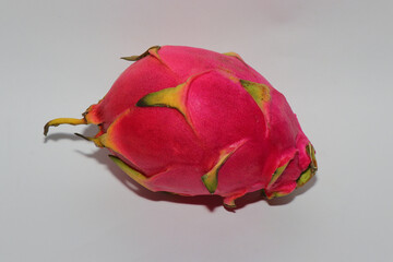 Fresh Dragon Fruit (Pitaya) on White Background, Exotic Tropical Fruit with Vibrant Pink Skin and Juicy Pulp, Healthy Food Concept