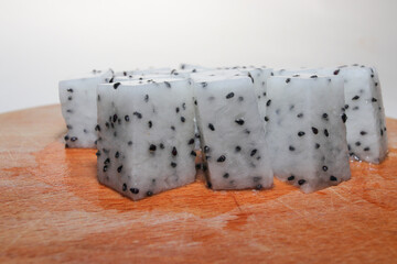 Fresh Dragon Fruit (Pitaya) on White Background, Exotic Tropical Fruit with Vibrant Pink Skin and Juicy Pulp, Healthy Food Concept