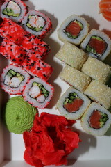 Assorted Japanese Sushi and Rolls on White Background, Minimalist Presentation with Fresh Seafood and Traditional Asian Cuisine