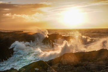 Fototapeta premium Sunrise at Rhoscolyn with rough seas Anglesey North wales