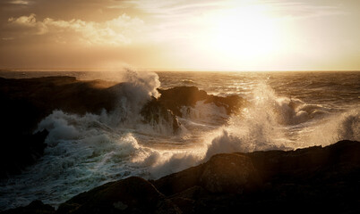 Sunrise at Rhoscolyn with rough seas Anglesey North wales