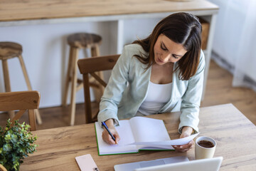 Laptop and writing with business woman in office for real estate broker, property listing and planning. Escrow account closer, real estate agent proposal and project with person in agency for report.