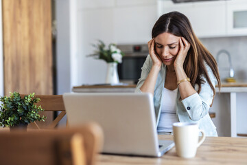 Laptop, remote work and stress with woman at window in home for burnout, pressure or tension. Computer, headache and overworked with freelance employee in apartment for planning or research fatigue.