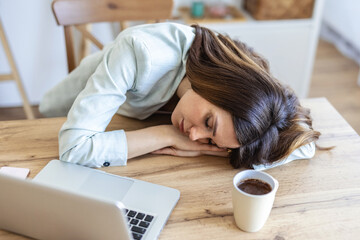 Tired, sleeping and woman on laptop for remote work exhausted for project, report and working from home. Stress, overworked and female person with burnout for nap, relaxing and resting from fatigue.