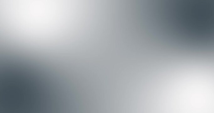 Abstract silver gray and white gradient background with soft blur, smooth color transitions, subtle light glow, and clean modern tones. Elegant bright backdrop ideal for seamless loopable 4K motion 