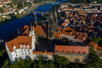 Aerial view of the gothic Meissen Cathedral and Albrechtsburg Castle with red rooftops contrasting against the Elbe river, Meissen, Sachsen, Germany.