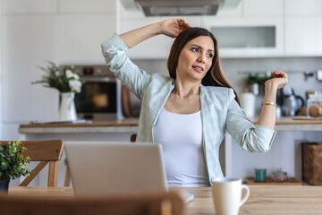 Smile, stretching and woman at desk in home office with research, achievement and deadline for freelance project. Remote work, relax and happy consultant at laptop with good news, email and success.