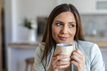 Working from home, freelancer and thinking entrepreneur drinking coffee, taking break and doing remote work while daydreaming idea. Smiling and thoughtful woman planning strategy, vision and mindset