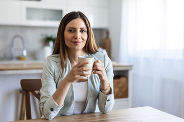 Thinking, planning and working from home on laptop while entrepreneur drinks coffee, tea or hot drink to help concentrate. Freelance blogger or writer with vision ideas, strategy and blog innovation.